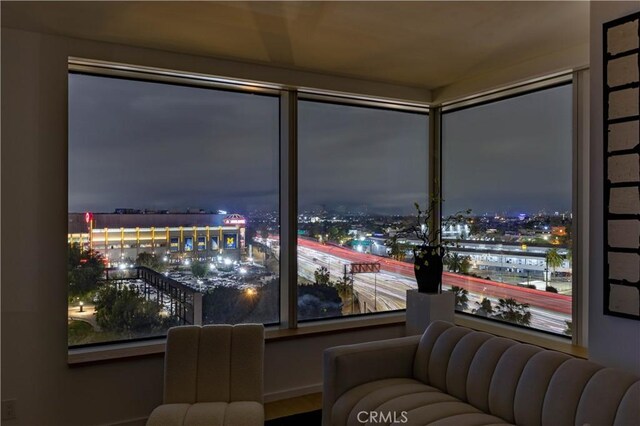 living area featuring a view of city lights