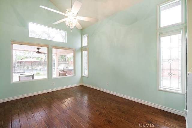 29827 Via Sevilla, Temecula, CA 92591 - spare room featuring high vaulted ceiling, baseboards, a ceiling fan, and dark wood-style floors