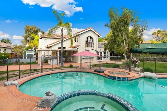 29827 Via Sevilla, Temecula, CA 92591 - view of pool featuring a gate, fence, a patio, and a pool with connected hot tub