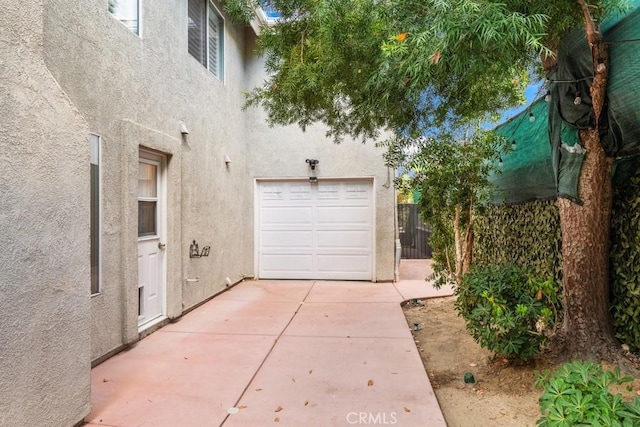 29827 Via Sevilla, Temecula, CA 92591 - garage featuring fence and concrete driveway
