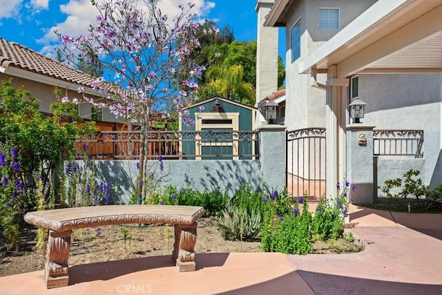 29827 Via Sevilla, Temecula, CA 92591 - view of patio / terrace with an outbuilding and a gate
