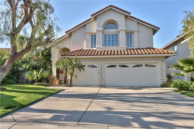 31384 Corte Tunas, Temecula, CA 92592 - mediterranean / spanish house featuring driveway, a tile roof, a garage, stucco siding, and a front lawn