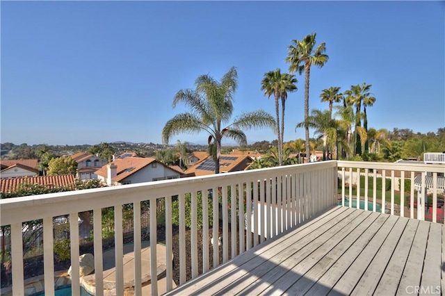 wooden terrace featuring a residential view