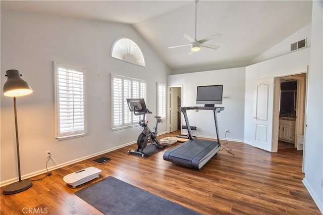exercise area with vaulted ceiling, ceiling fan, wood finished floors, and baseboards