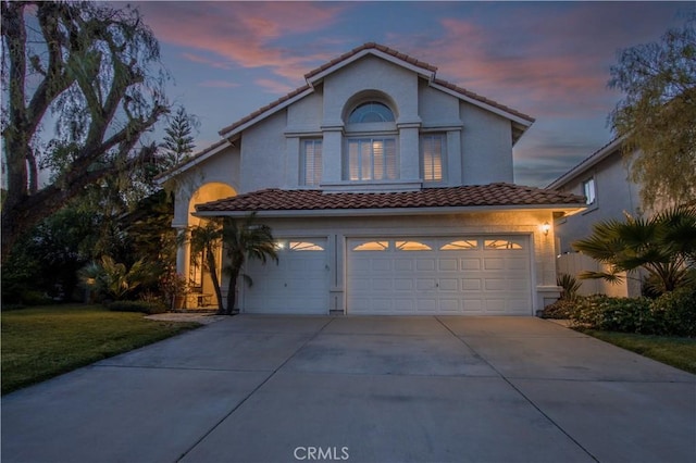 31384 Corte Tunas, Temecula, CA 92592 - mediterranean / spanish-style home featuring a garage, a tile roof, driveway, a yard, and stucco siding