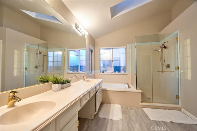31384 Corte Tunas, Temecula, CA 92592 - full bath featuring a shower stall, vaulted ceiling, a garden tub, a skylight, and double vanity