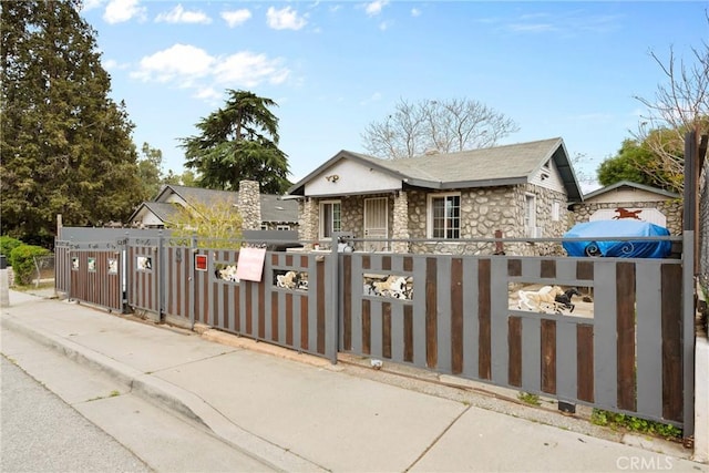 view of gate featuring a fenced front yard
