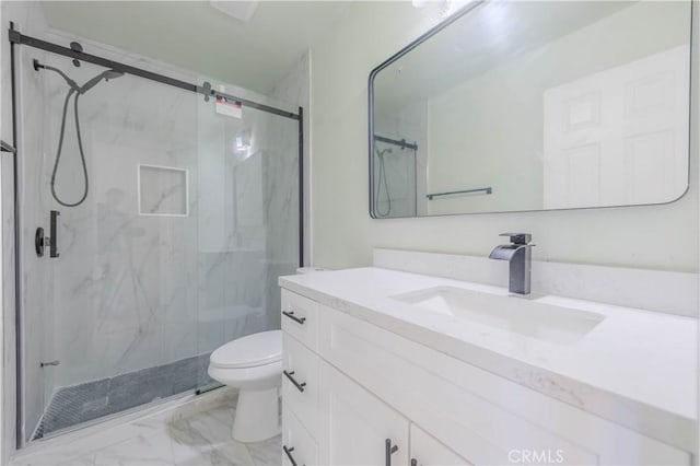 full bathroom with vanity, marble finish floor, a marble finish shower, and toilet