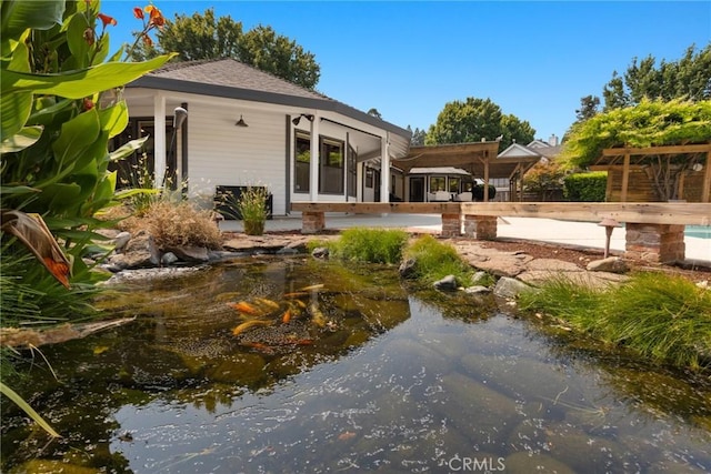650 Crimson Ct, Chico, CA 95973 - rear view of property with a small pond