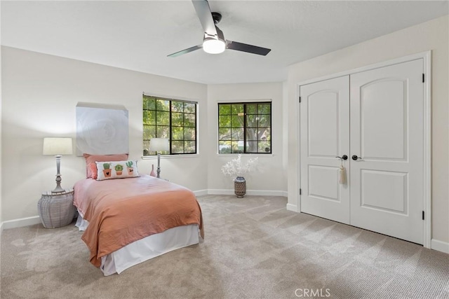 650 Crimson Ct, Chico, CA 95973 - bedroom with light carpet, baseboards, a closet, and a ceiling fan