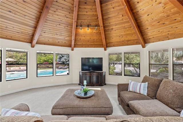 living room with wood ceiling, carpet floors, beam ceiling, and baseboards