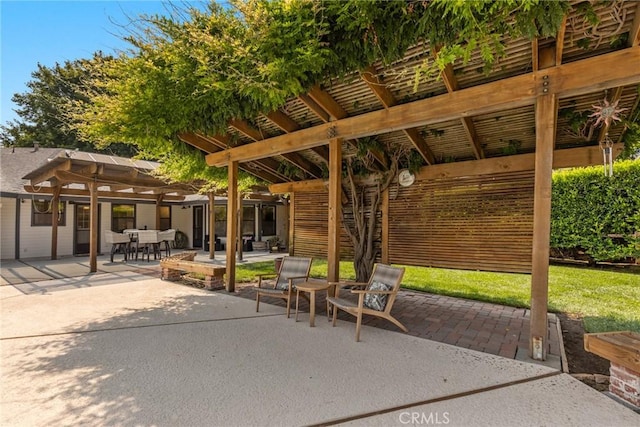view of patio / terrace featuring a pergola and outdoor dining area