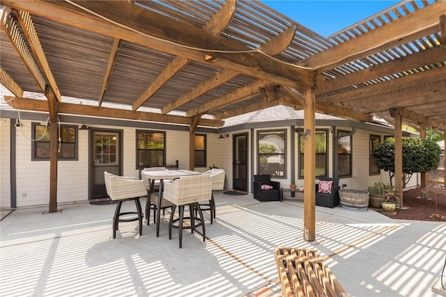 view of patio / terrace with outdoor dining area and a pergola
