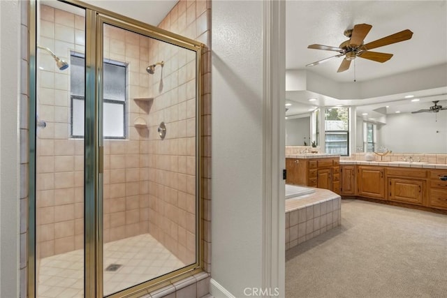 full bath featuring a shower stall, ceiling fan, a healthy amount of sunlight, and vanity