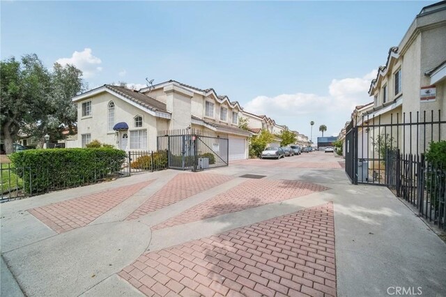 21021 Gault St Unit 9, Canoga Park, CA 91303 - view of decorative road featuring a residential view and a gate