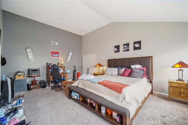 carpeted bedroom with high vaulted ceiling and visible vents