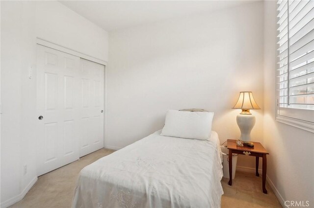 763 W 1st St Unit 80, Claremont, CA 91711 - bedroom with baseboards, carpet flooring, and a closet
