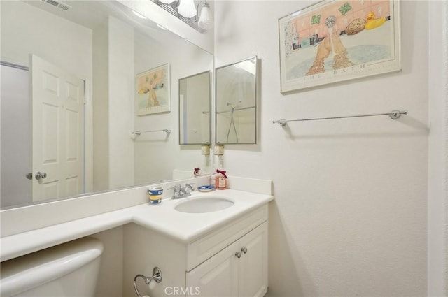 763 W 1st St Unit 80, Claremont, CA 91711 - bathroom with visible vents, vanity, and toilet
