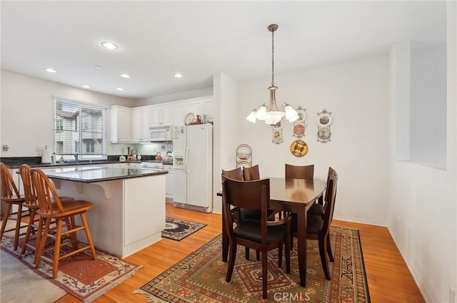 763 W 1st St Unit 80, Claremont, CA 91711 - dining room with recessed lighting, a chandelier, and light wood-type flooring