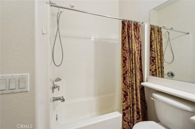 763 W 1st St Unit 80, Claremont, CA 91711 - full bathroom featuring a textured wall, shower / bathtub combination with curtain, and toilet
