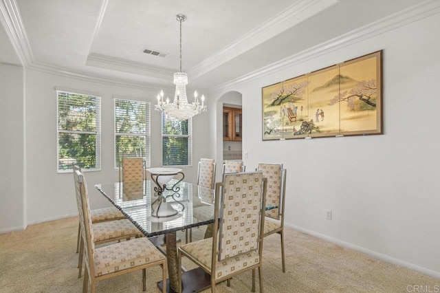 1450 Oakpoint Ave, Chula Vista, CA 91913 - dining room featuring a chandelier, carpet, arched walkways, a tray ceiling, and crown molding