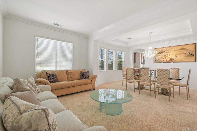 1450 Oakpoint Ave, Chula Vista, CA 91913 - living room featuring a chandelier, carpet flooring, arched walkways, ornamental molding, and a tray ceiling