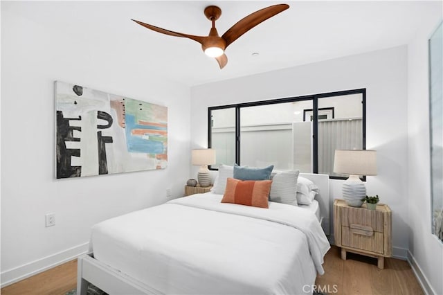 4017 Channel Pl, Newport Beach, CA 92663 - bedroom featuring baseboards, a ceiling fan, and wood finished floors