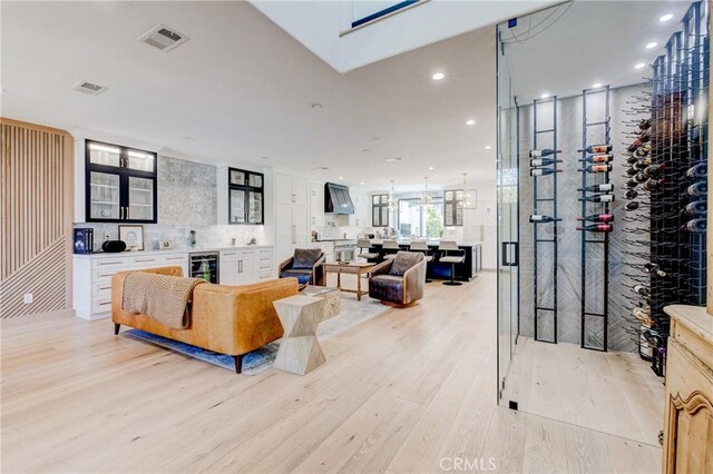 1852 6th St, Manhattan Beach, CA 90266 - living area featuring light wood-style flooring, wine cooler, and recessed lighting