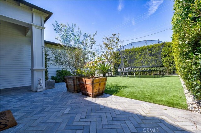1852 6th St, Manhattan Beach, CA 90266 - view of patio with a trampoline