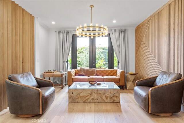 1852 6th St, Manhattan Beach, CA 90266 - living area with a chandelier, light wood finished floors, recessed lighting, and wood walls