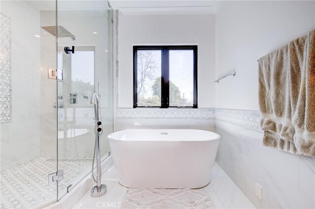 1852 6th St, Manhattan Beach, CA 90266 - bathroom featuring a shower stall, a freestanding bath, tile walls, a wainscoted wall, and tile patterned flooring