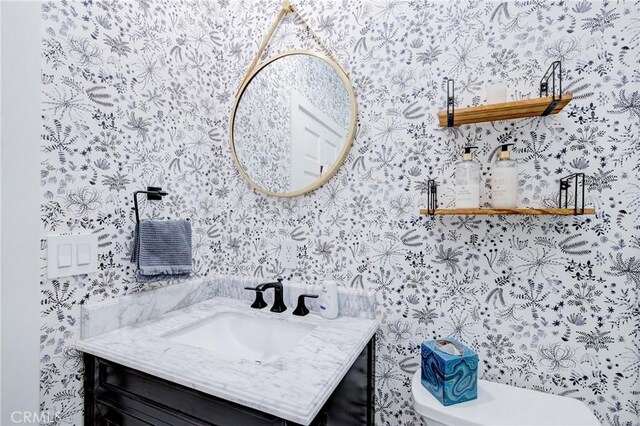 1852 6th St, Manhattan Beach, CA 90266 - bathroom with wallpapered walls, toilet, and vanity