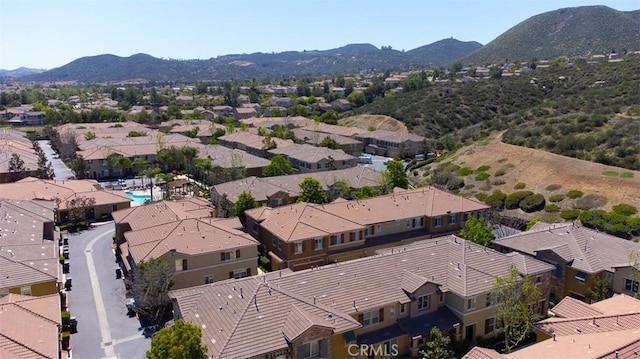 birds eye view of property with a mountain view and a residential view