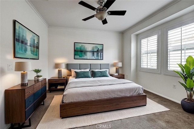 bedroom featuring baseboards, carpet flooring, ceiling fan, and crown molding