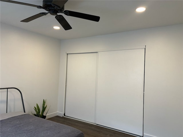 bedroom featuring recessed lighting, a closet, baseboards, a ceiling fan, and dark wood-type flooring