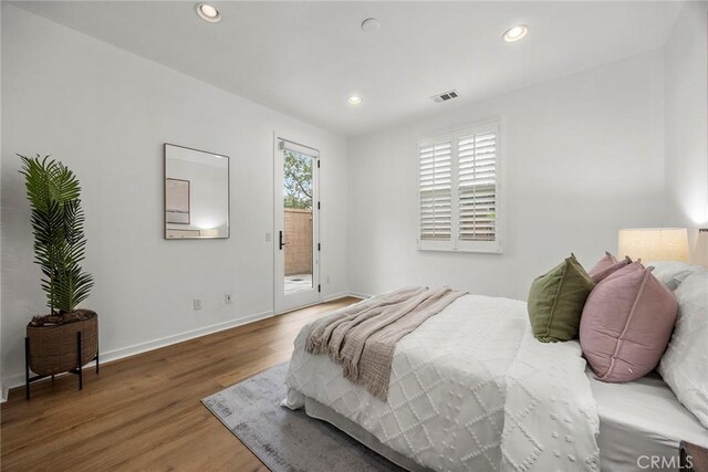 130 Borrego, Irvine, CA 92618 - bedroom featuring access to exterior, wood finished floors, and recessed lighting