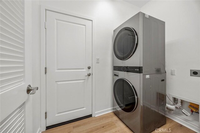 130 Borrego, Irvine, CA 92618 - washroom with estacked washer and dryer and light wood finished floors