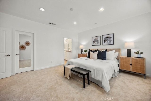 bedroom featuring light carpet, baseboards, and visible vents