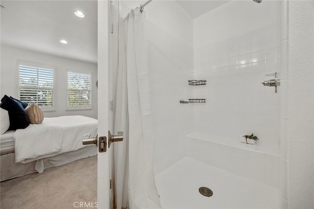 bathroom with recessed lighting, ensuite bath, and tiled shower