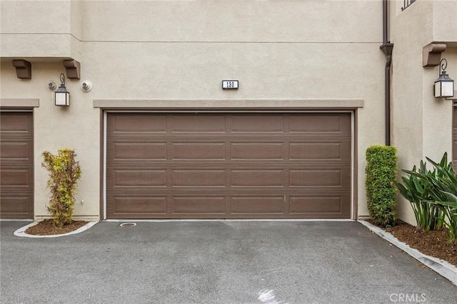 garage featuring driveway
