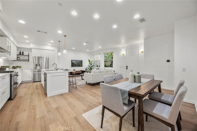 dining room with recessed lighting, visible vents, and light wood-style floors