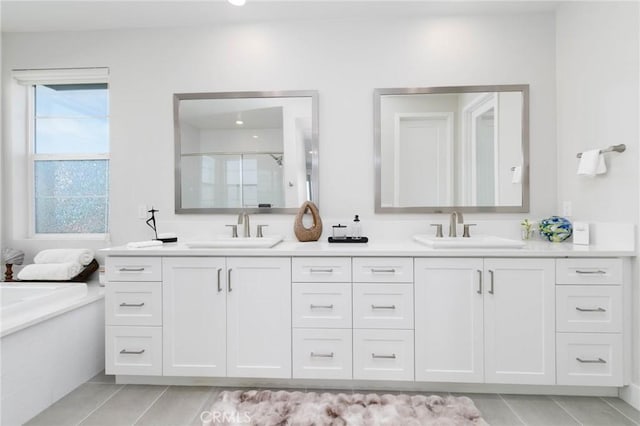 102 Pattern, Irvine, CA 92618 - bathroom featuring a garden tub, a sink, a shower stall, and double vanity
