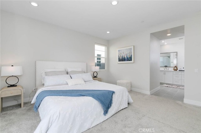 102 Pattern, Irvine, CA 92618 - carpeted bedroom featuring recessed lighting, connected bathroom, baseboards, and a sink