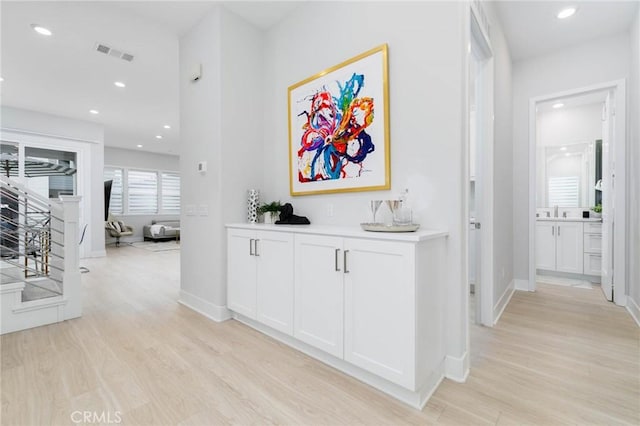 102 Pattern, Irvine, CA 92618 - hallway with light wood finished floors, baseboards, visible vents, and recessed lighting