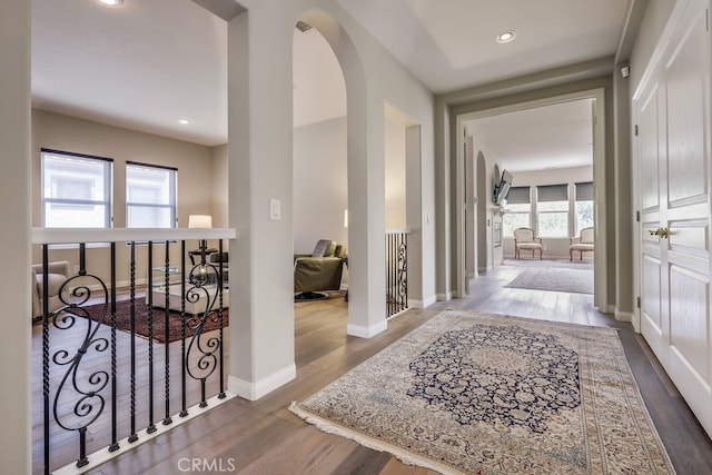 44 Water Lily Way, Coto De Caza, CA 92679 - hallway featuring wood finished floors, an upstairs landing, arched walkways, baseboards, and recessed lighting
