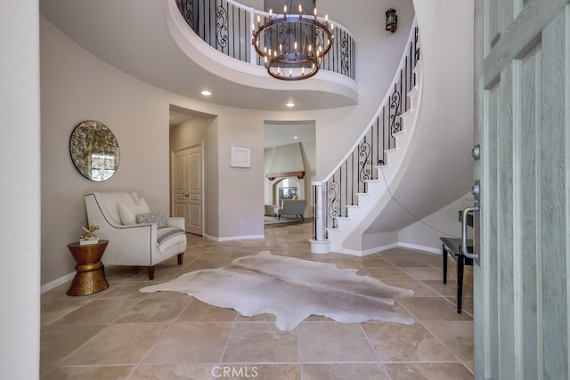 44 Water Lily Way, Coto De Caza, CA 92679 - foyer featuring baseboards, a notable chandelier, a towering ceiling, and stairs