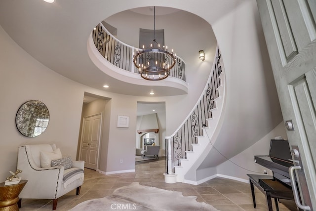44 Water Lily Way, Coto De Caza, CA 92679 - foyer entrance featuring a towering ceiling, a chandelier, stairs, and baseboards