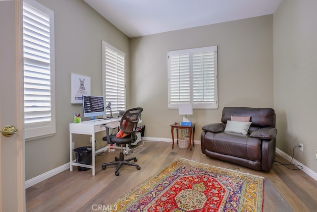 44 Water Lily Way, Coto De Caza, CA 92679 - home office featuring wood finished floors, a healthy amount of sunlight, and baseboards