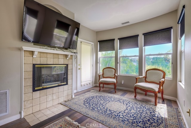 44 Water Lily Way, Coto De Caza, CA 92679 - living room with baseboards, wood finished floors, visible vents, and a fireplace