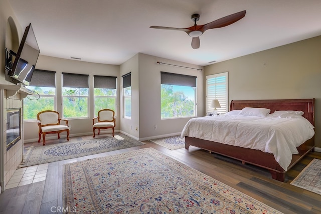 44 Water Lily Way, Coto De Caza, CA 92679 - bedroom featuring baseboards, a tile fireplace, wood finished floors, and ceiling fan